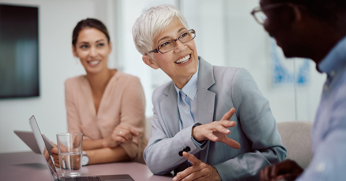 Banker and employee talking at a table