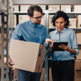 Small business owners managing inventory